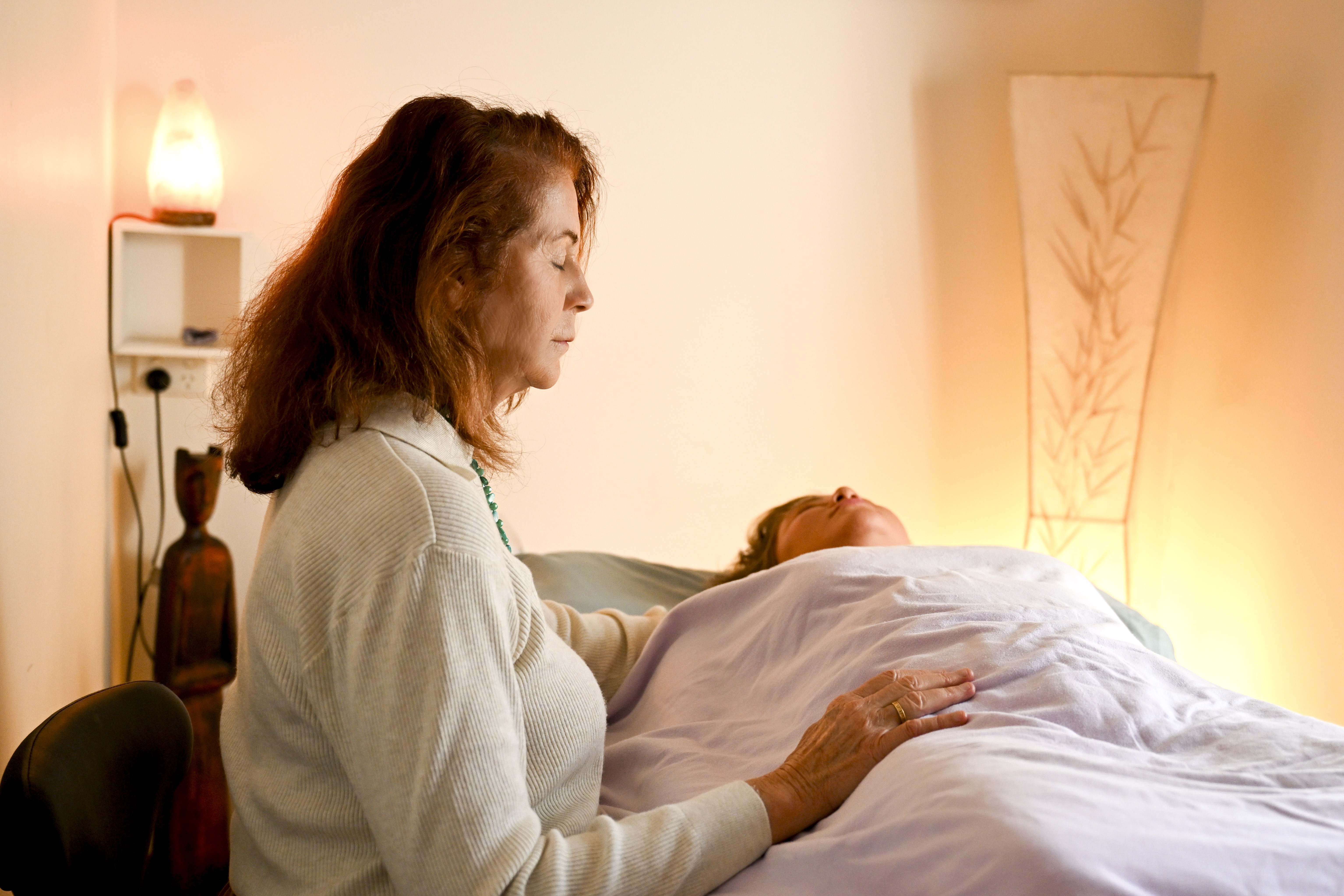 Vicki Jacobsen performing biodynamic craniosacral therapy in her Central Coast treatment room